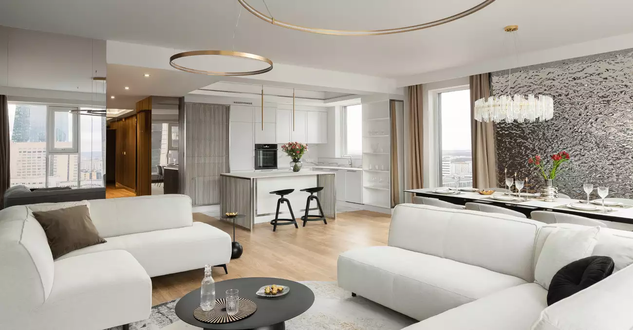 Kuchnia otwarta na salon - projekt strefy dziennej w apartamencie